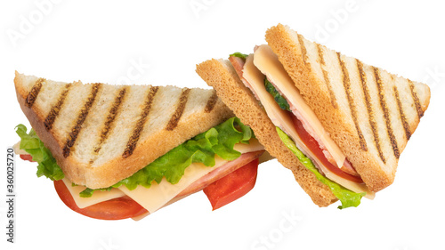 Sandwich with ham, cheese, tomato, lettuce and toasted bread isolated on a white background