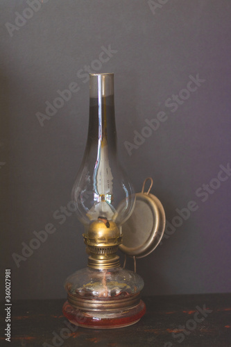 old oil lamp on wooden table