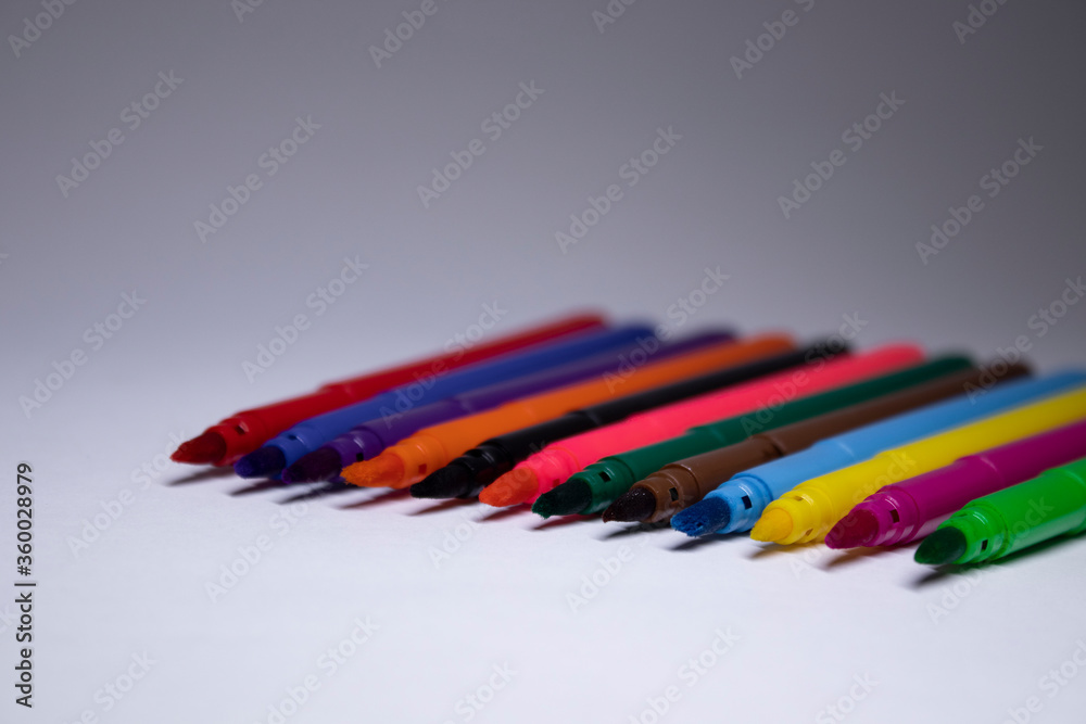 multicolored felt-tip pens on a white background. stationery concept. copy space. isolated. High quality photo multicolored felt-tip pens on a white background. stationery concept. copy space. isolated. High quality photo