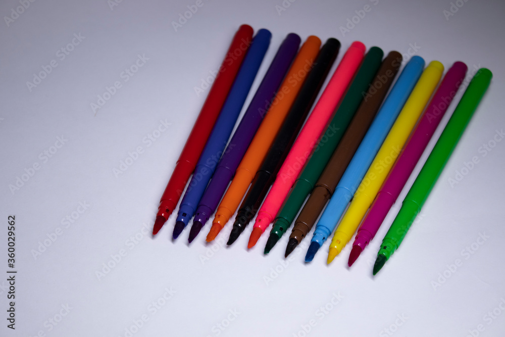 multicolored felt-tip pens on a white background. stationery concept. copy space. isolated. High quality photo multicolored felt-tip pens on a white background. stationery concept. copy space. isolated. High quality photo