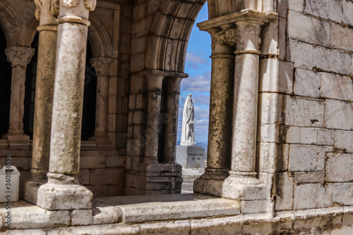 Wonderful sacred and religious architecture formed by church and statues with birds flying in the center of the Portuguese city of Estremoz in the interior of the Alentejo.