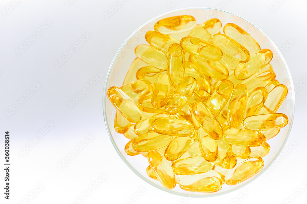 Yellow capsules of vitamin omega 3. Dietary Supplement. Fish oil in capsules.
