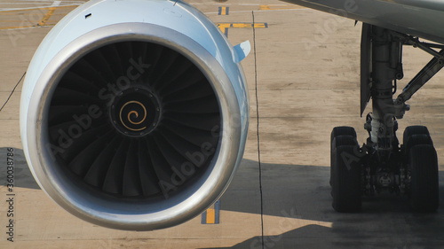 Close-up of a slow-moving aircraft engine in the parking lot.