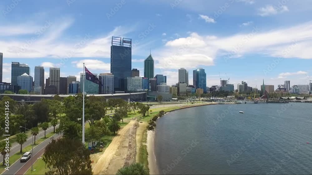 Beautiful drone shot flying towards Perth CBD in Western Australia on a gorgeous summers day, blue skies with few clouds. (Wide shot) Beautiful drone shot flying towards Perth CBD in Western Australia on a gorgeous summers day, blue skies with few clouds. (Wide shot)
