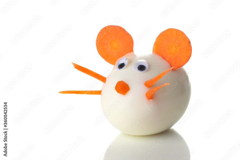 Food art creative concepts. Cute mouse made of boiled egg, sesame seeds and carrots over white background. Food art creative concepts. Cute mouse made of boiled egg, sesame seeds and carrots over white background.