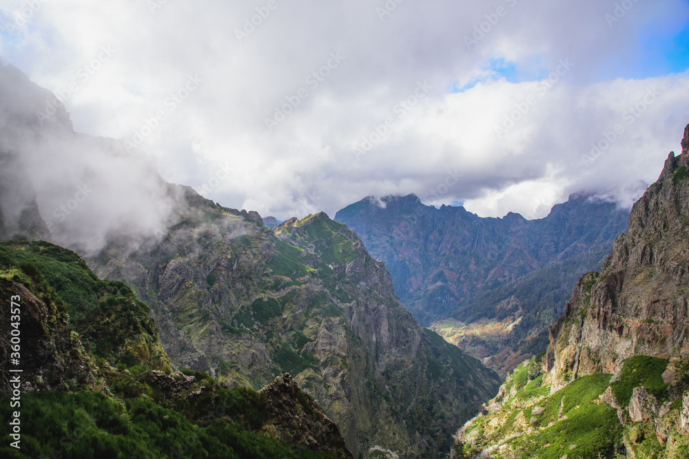 Mountain landscape. View of mountains and fog on the route Pico Areeiro - Pico Ruivo, Madeira Mountain landscape. View of mountains and fog on the route Pico Areeiro - Pico Ruivo, Madeira