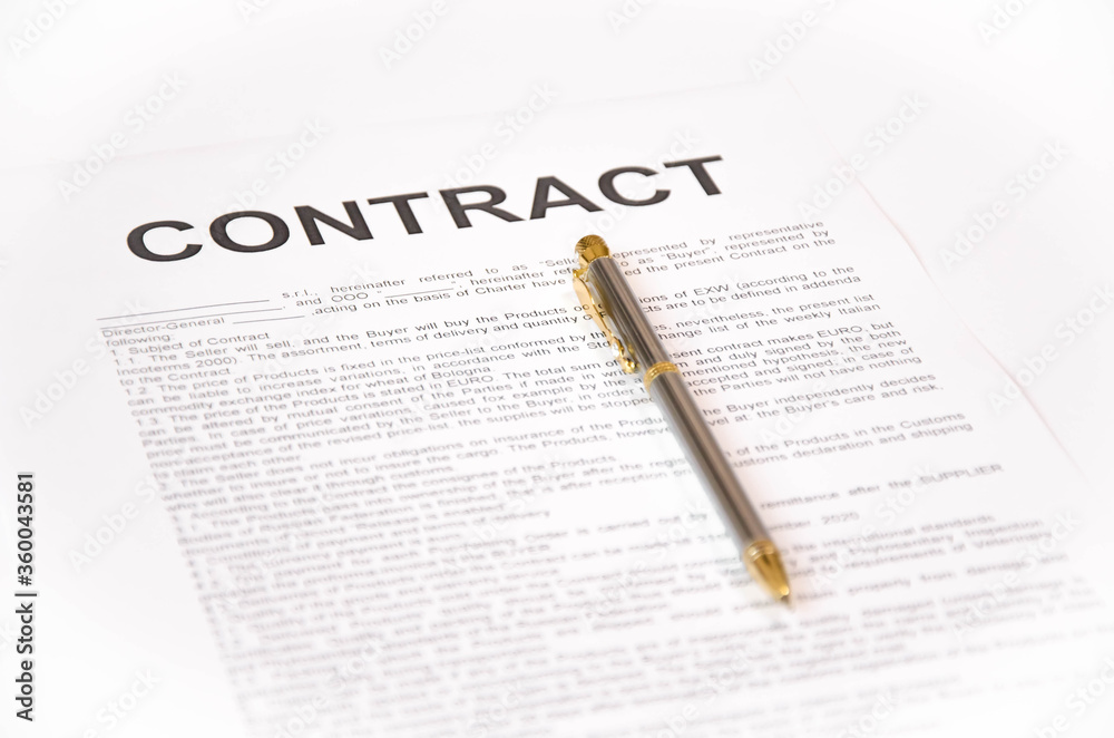 Obraz premium pen and contract on a white background. signing a contract