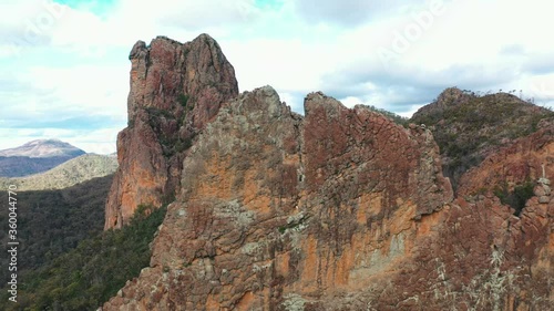 Breathtaking Australian mountain rock formation in outback, aerial arc shot photo