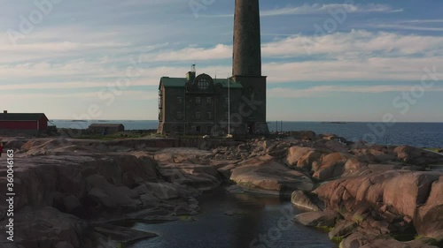 Aerial view of Bengtskär lighthouse during setting sun. The lighthouse is the tallest lighthouse in the Nordic countries and is famous for the beautiful surroundings. photo