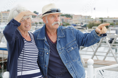 happy senior couple in a port