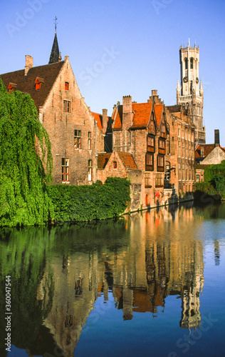 Reflection in a canal in Bruges, Belgium, of the Church of Our Lady.