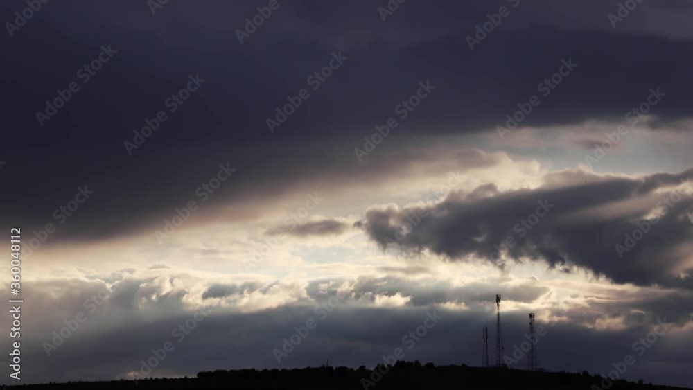 time lapse of fast moving clouds at sunset