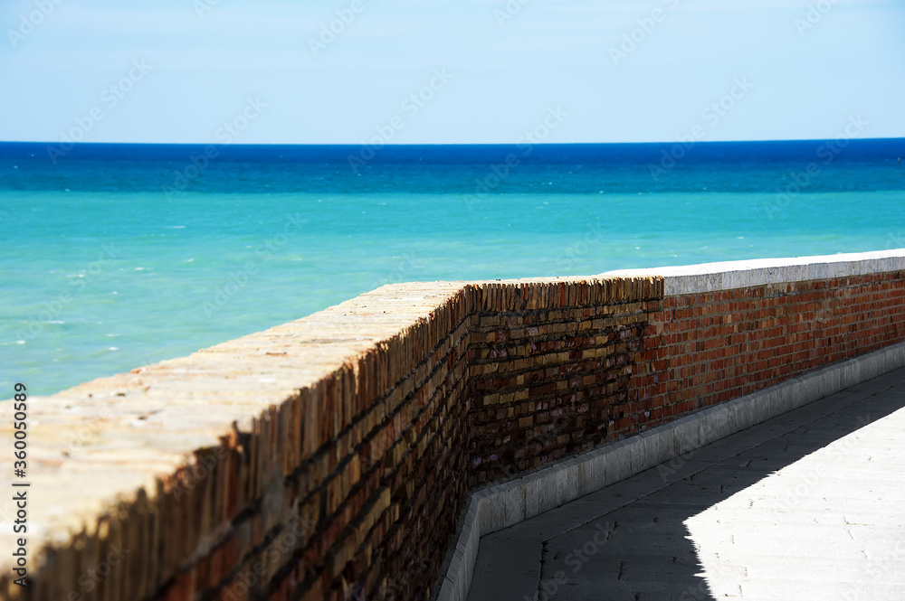 Fototapeta premium View of a typical city street overlooking the beautiful sea, Termoli a tourist town on the Adriatic Sea in the province of Campobasso, in the Molise region, southern Italy