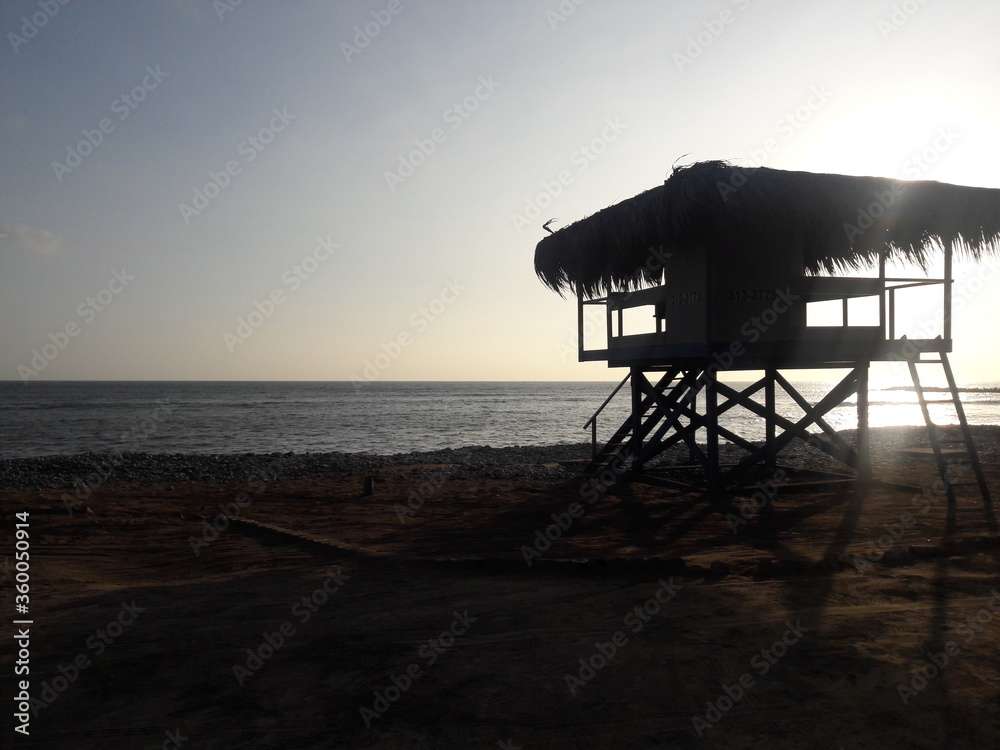Silhouette of lifeguard stand on beach in Miraflores Lima Peru 2019