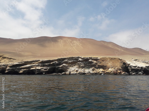Paracas Peru carvings on side of mountain 2019