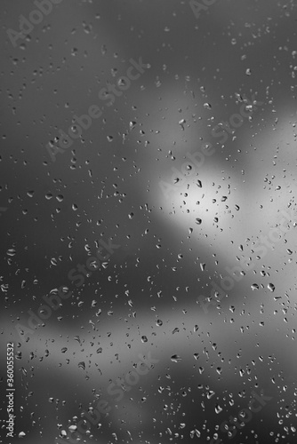 raindrops on window black and white