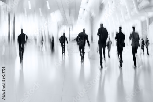 group of people in the lobby business center and blue tonality