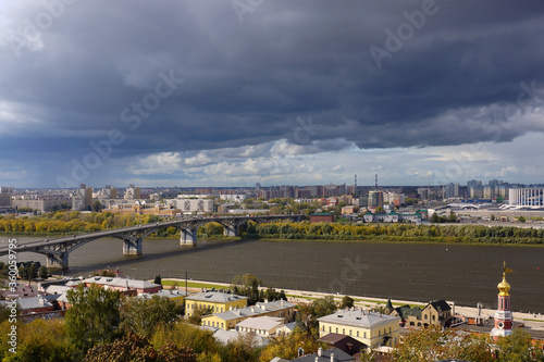 Nizhny Novgorod, Russia - September 17, 2019. Panorama of the city. Kanavinsky bridge over the Oka. Thunder Sky. © irene_rebrova