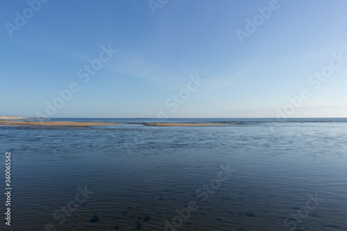 The natural phenomena off the rocks emerging out of the sea at low tide and which form shapes known locally as the horses of Fão, Esposende, Portugal. photo