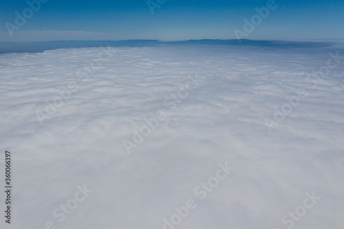 The marine layer has seeped into the East Bay in the San Francisco Bay region. This cloudy and sometimes foggy air mass develops over the ocean in the presence of a temperature inversion. © ead72