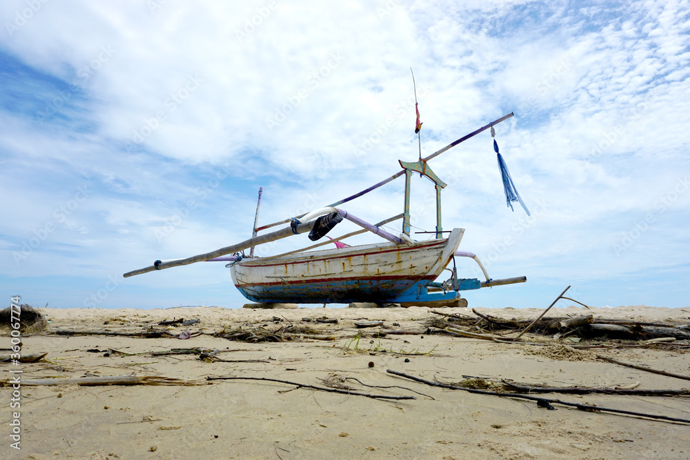 Sailboat on the sand, sailboat lie on the beach waiting for a sailor. 