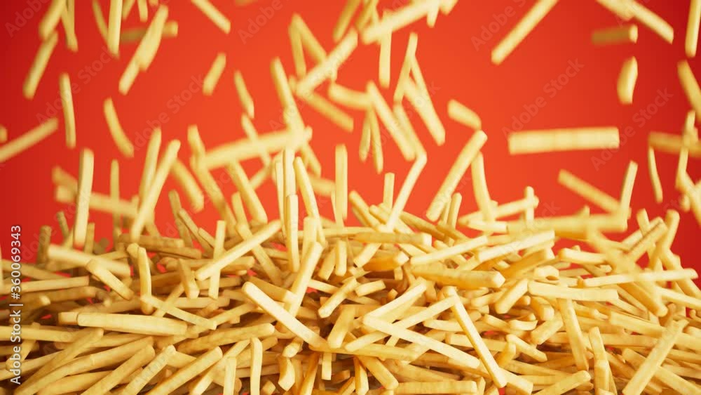 French fries falling down and forming the pile. Fast food. Chips. Red background French fries falling down and forming the pile. Fast food. Chips. Red background
