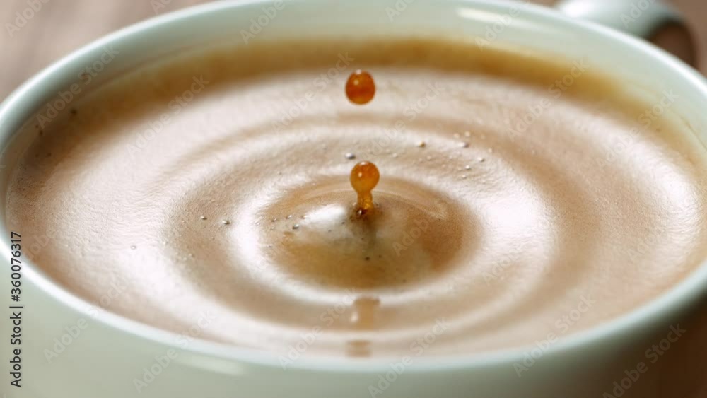 Falling sugar cane into coffee cup, super slow moton at 1000 fps.