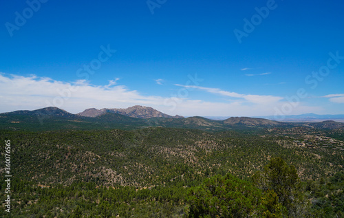 The views from the top of the trail on Prescott, Arizona's Thumb Butte. In the distance you can see Granite Mountain, and the San Francisco Peaks.