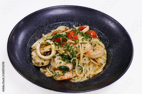 seafood linguine pasta with shrimps, mussels and squid. Italian food speciality.