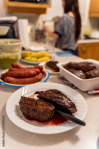 Home made BBQ dinner with steak, chorizo and corn