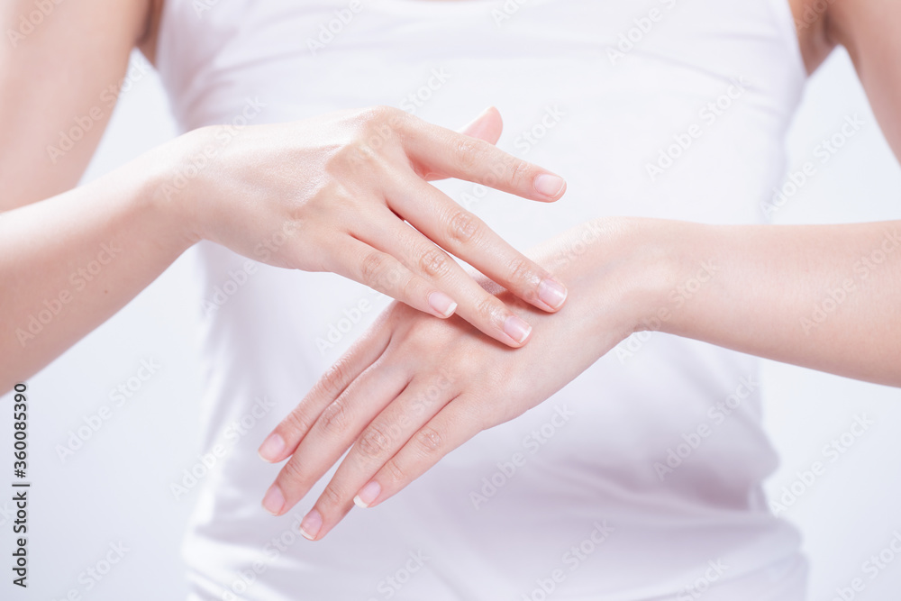 closeup of female hands applying hand cream,Lotion closeup of female hands applying hand cream,Lotion