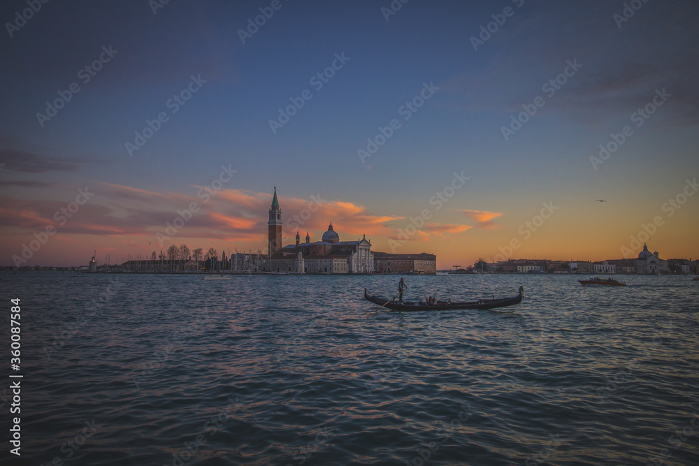 Sunset in Venice and gondola, Italy