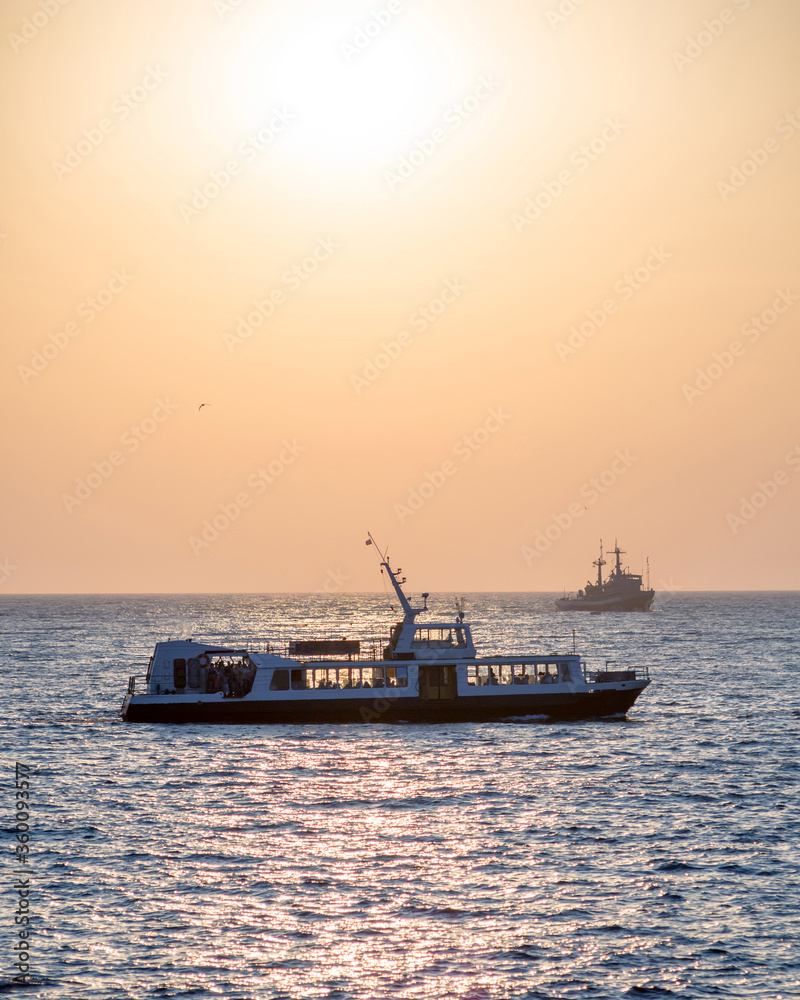 Excursion ship on the background of the sunset on the Black Sea