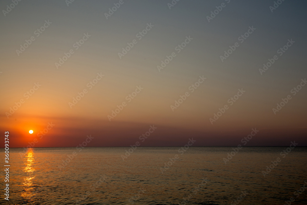 Sunset on the beach of the Azov Sea