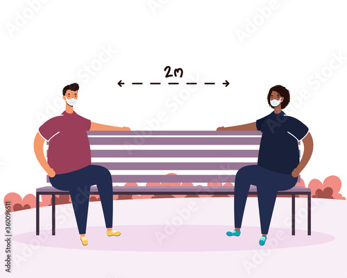 interracial couple practicing social distancing in park chair