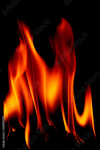 Real fire line flames isolated on black background. Mockup fire wall.