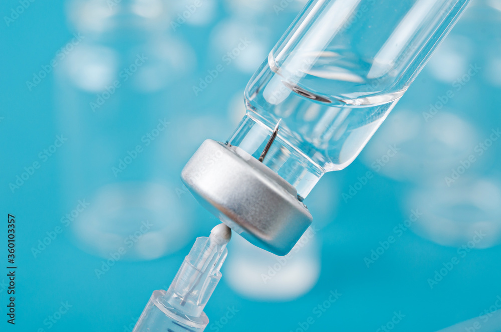 Vaccine and syringe injection.