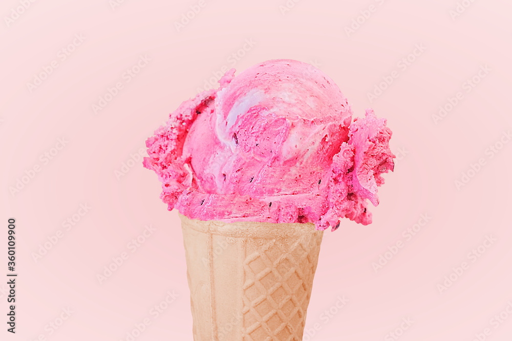 strawberry pink ice cream scoop on cone isolated on pink background