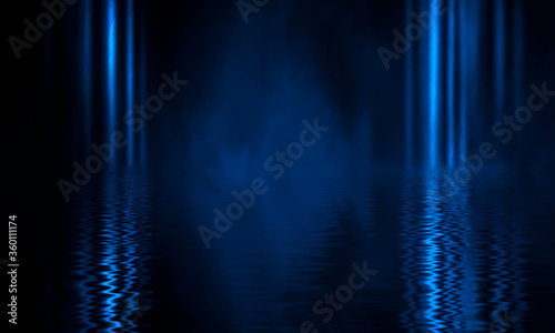 Background of empty stage show. Neon blue and purple light and laser show. Laser futuristic shapes on a dark background. Abstract dark background with neon glow
