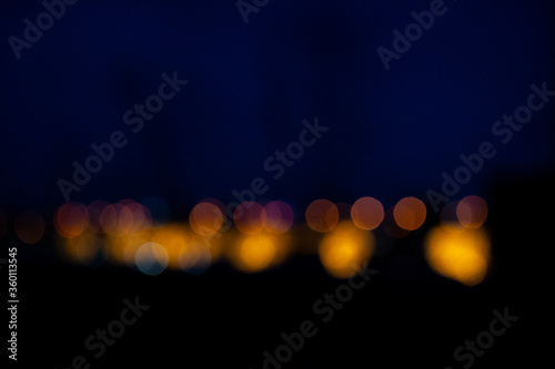 Golden bokeh background. Christmas glowing lights. Holiday decorative effect.