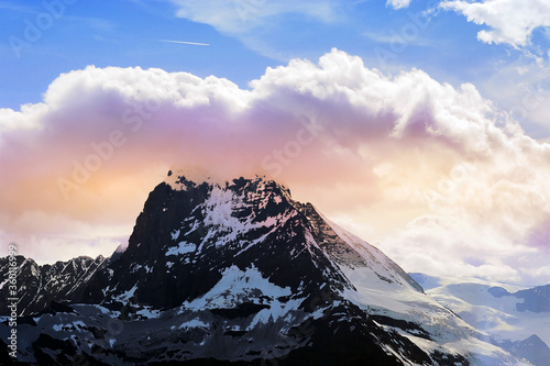 Matterhorn peak covering by cloud on evening with sunset vanilla sky © Artorn