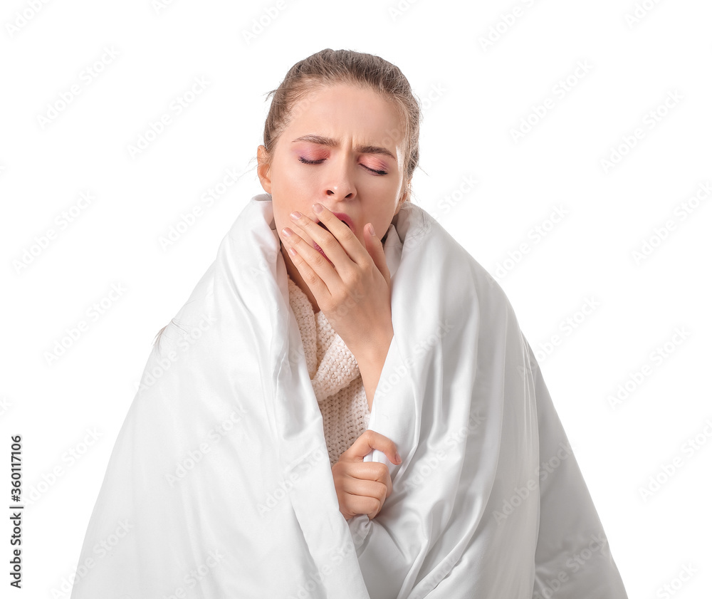 Tired woman with blanket on white background. Concept of sleep deprivation Tired woman with blanket on white background. Concept of sleep deprivation