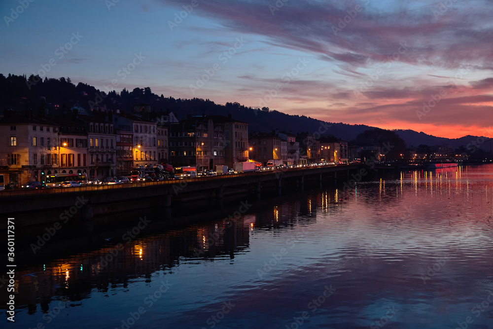 Amazing red sunset and Rhone river in Vienne, France
