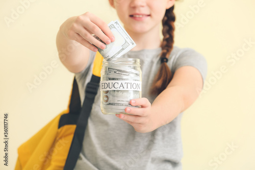 Girl with savings for educa...