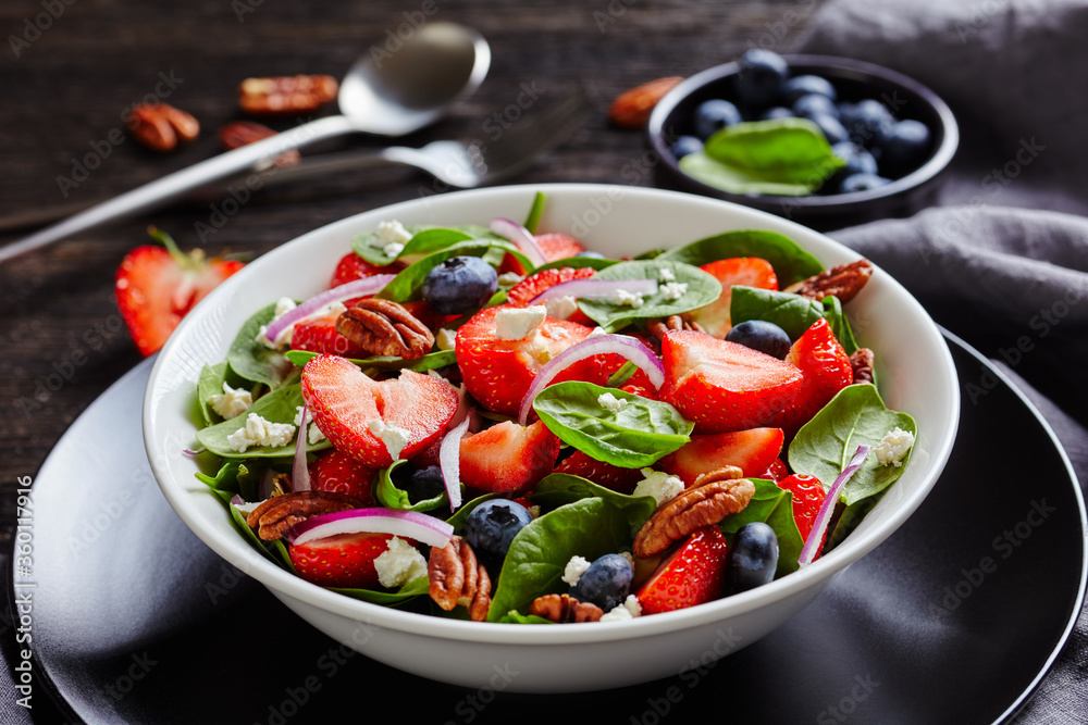 close-up of berry spinach pecan summer salad