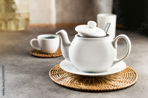 White porcelain teacup and teapot