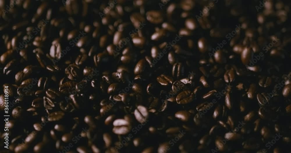 4K Espresso Beans Falling Into Roaster, Oily Dark Roast Coffee Rotating in Cinematic Close Up Macro While More Beans Fall in Slow Motion 4K Espresso Beans Falling Into Roaster, Oily Dark Roast Coffee Rotating in Cinematic Close Up Macro While More Beans Fall in Slow Motion