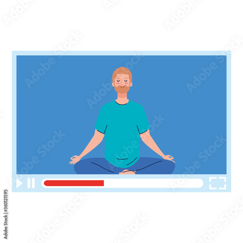online, yoga concept, man practices yoga and meditation, watching a broadcast on a web page