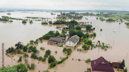 Aerial view Floods and flooded houses. Mass natural disasters and destruction. A big city is flooded after floods and rains.