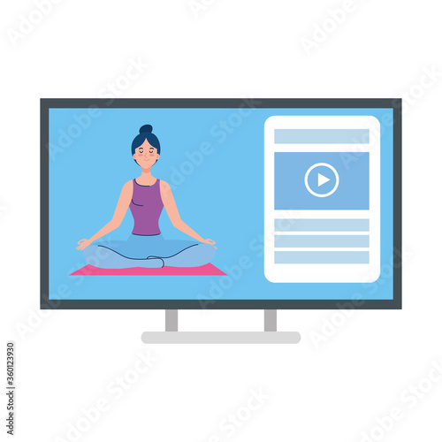 online, yoga concept, woman practices yoga and meditation, watching a broadcast on a computer